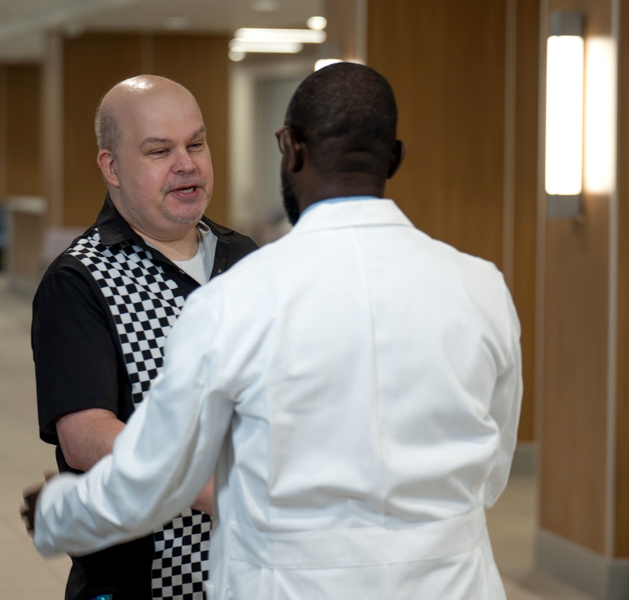 Patient Mike Nelson and Cardiothoracic Surgeon Ayodele Osasona, M.D.